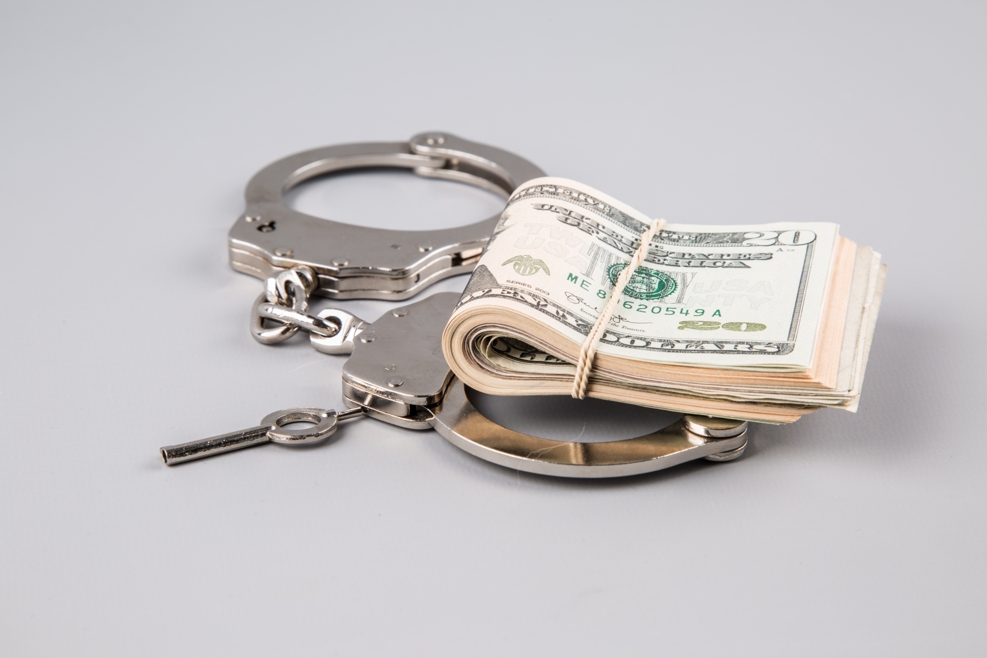 handcuffs-and-money-1462610031nnq