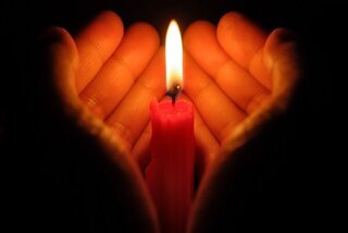 depositphotos-22724789-stock-photo-hands-holding-a-burning-candle