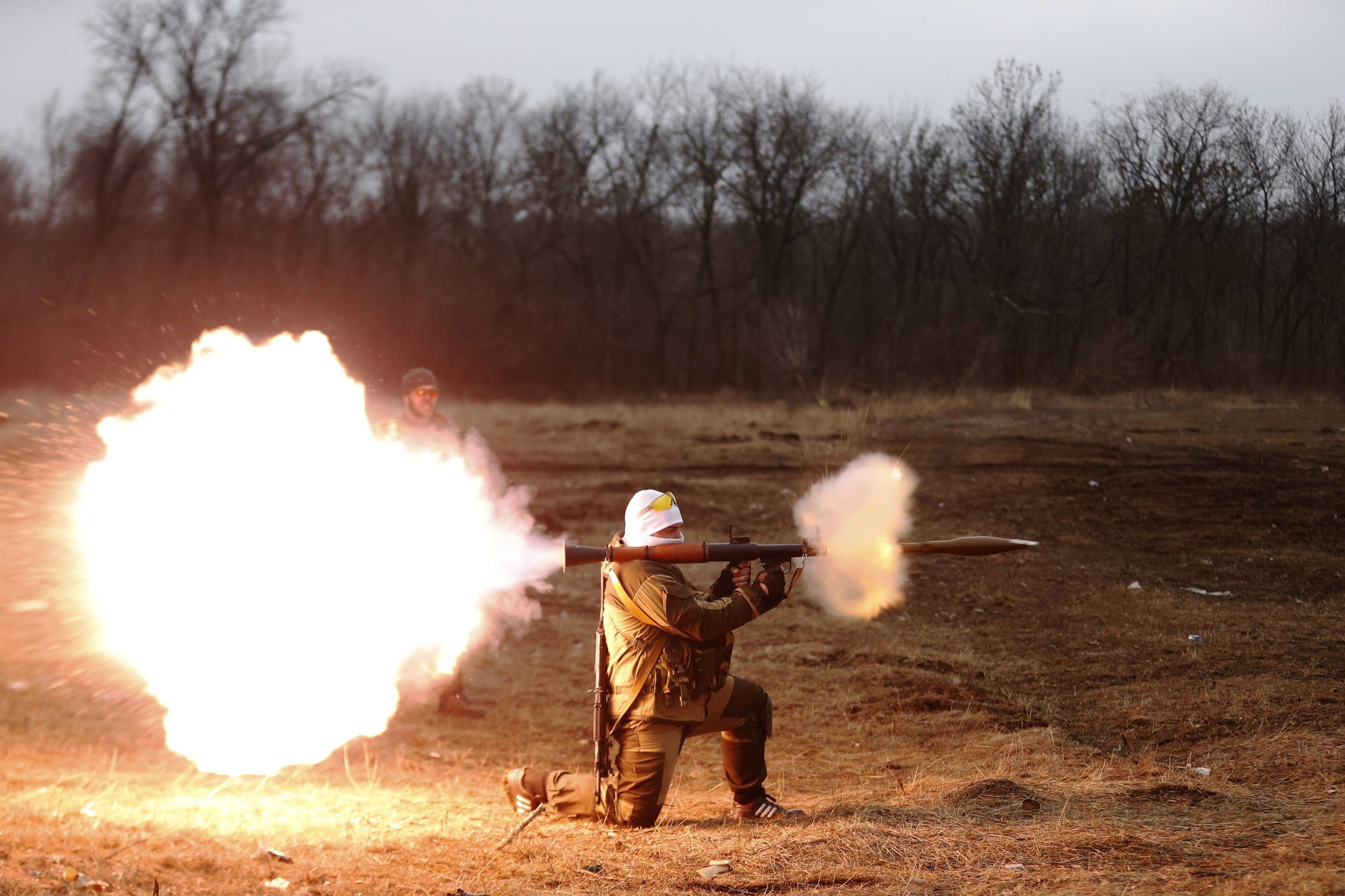 A volunteer of the separatist self-proclaimed Donetsk People's Republican guard fires a rocket-propelled grenade (RPG) during shooting training in Donetsk