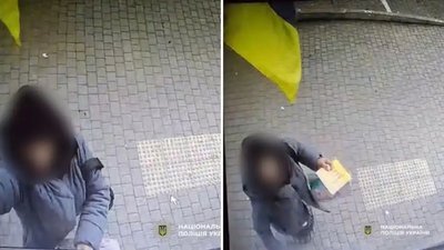 В Одесі жінці, яка самовільно зняла прапор України з фасаду магазину, оголосили підозру